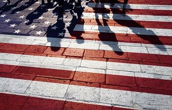 Shadow of Immigrant Family on American Flag